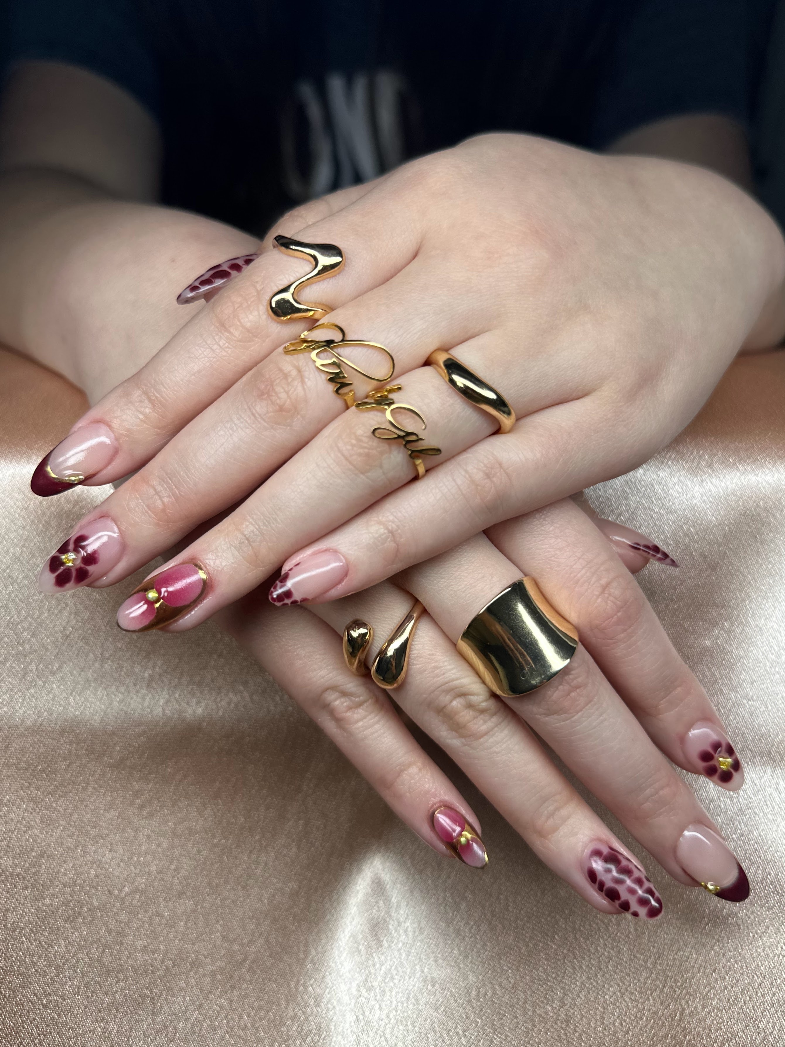 Pink and burgundy French tips with small florals and dot art