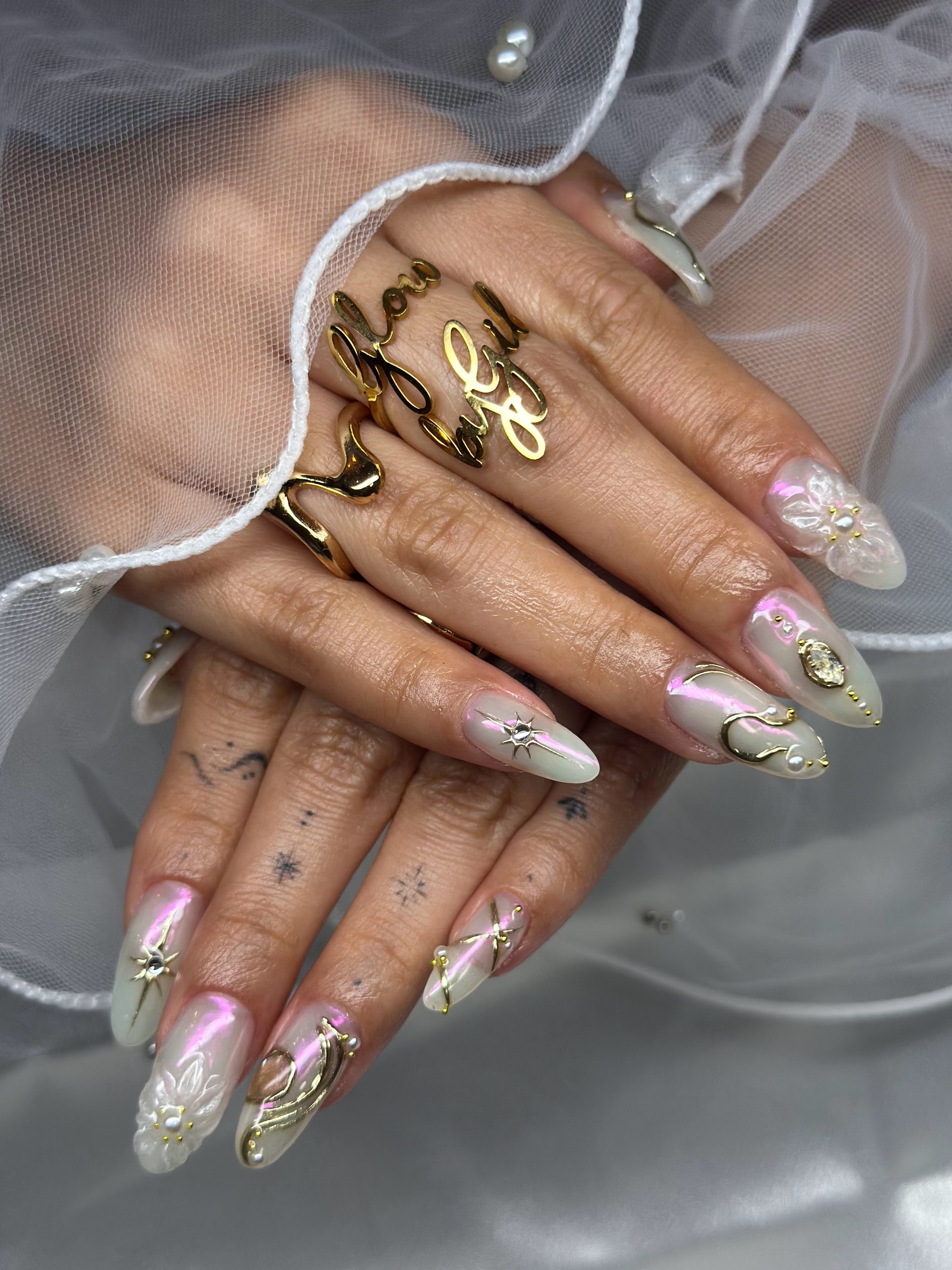Pearl white aurora nails with 3D sculpted butterflies and flowers
